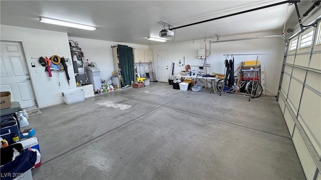 4910 Marywood Ct, Pahrump, NV 89061 - garage with water heater and a garage door opener