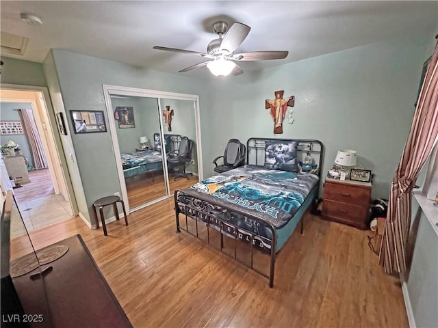 4910 Marywood Ct, Pahrump, NV 89061 - bedroom featuring light wood-style flooring, a closet, and a ceiling fan