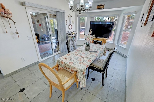 4910 Marywood Ct, Pahrump, NV 89061 - dining space with a chandelier and light tile patterned floors