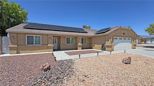 4910 Marywood Ct, Pahrump, NV 89061 - ranch-style home with concrete driveway, solar panels, and stucco siding