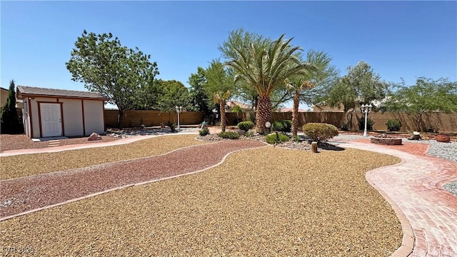 4910 Marywood Ct, Pahrump, NV 89061 - fenced backyard with an outdoor fire pit and a storage unit