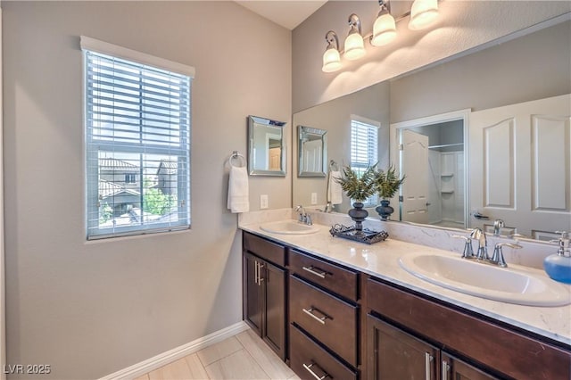 9113 Sea Mink Ave, Las Vegas, NV 89149 - bathroom featuring double vanity and a shower