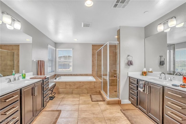 2154 Tortona St, Henderson, NV 89044 - full bath featuring two vanities, a stall shower, tile patterned flooring, a bath, and recessed lighting