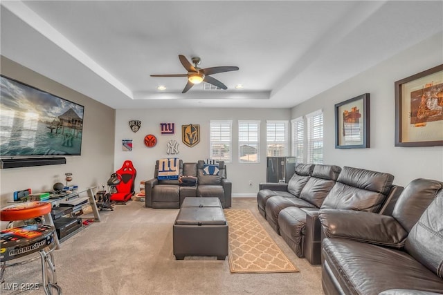 2154 Tortona St, Henderson, NV 89044 - living area with light colored carpet, a raised ceiling, ceiling fan, and recessed lighting