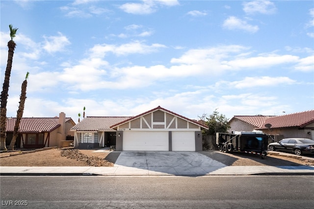 5570 Palm St, Las Vegas, NV 89120 - view of front of property with an attached garage, driveway, and stucco siding
