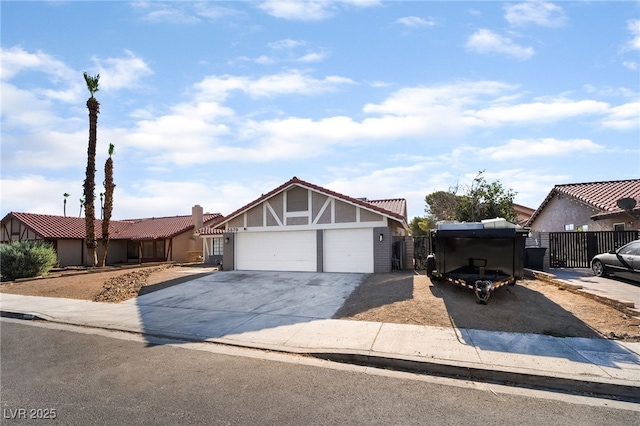 5570 Palm St, Las Vegas, NV 89120 - view of front of property with a garage, concrete driveway, stucco siding, a tile roof, and a gate