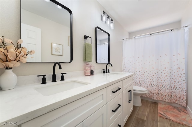 5570 Palm St, Las Vegas, NV 89120 - full bath featuring wood finished floors, double vanity, and a shower with curtain