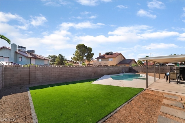 5570 Palm St, Las Vegas, NV 89120 - fenced backyard with a patio and a residential view