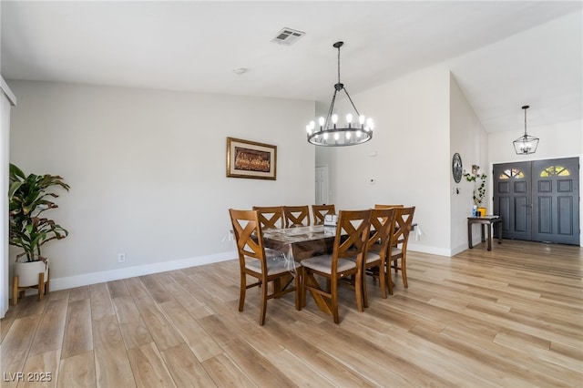 5570 Palm St, Las Vegas, NV 89120 - dining area featuring a chandelier, light wood-style floors, and lofted ceiling
