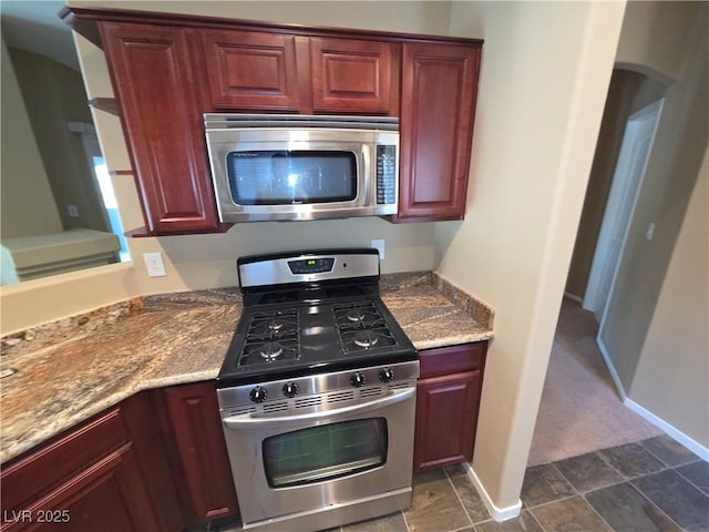 9000 Las Vegas Blvd Unit 2101, Las Vegas, NV 89123 - kitchen featuring stainless steel appliances, stone counters, and dark brown cabinets