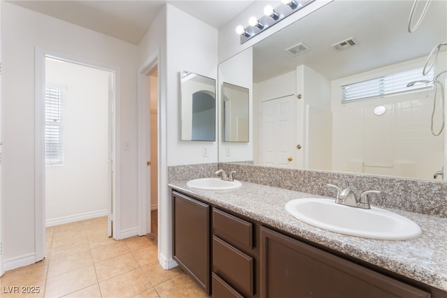 2400 Dutchmans Pipe Ct, Las Vegas, NV 89106 - bathroom with double vanity, a shower, and tile patterned flooring