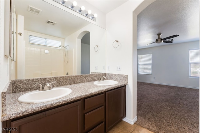 2400 Dutchmans Pipe Ct, Las Vegas, NV 89106 - bathroom featuring double vanity, plenty of natural light, ceiling fan, and a shower