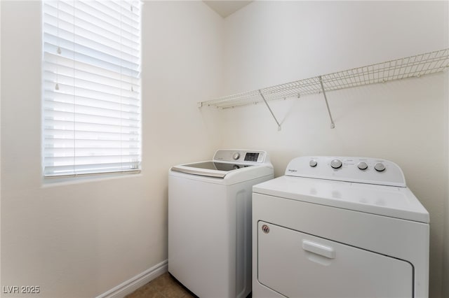 2400 Dutchmans Pipe Ct, Las Vegas, NV 89106 - laundry room with washing machine and dryer and tile patterned flooring
