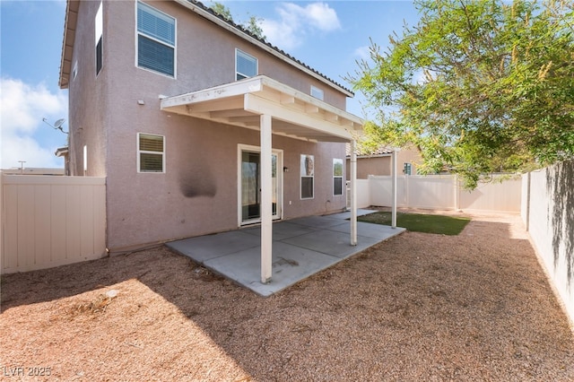 2400 Dutchmans Pipe Ct, Las Vegas, NV 89106 - back of property with stucco siding, a fenced backyard, and a patio area