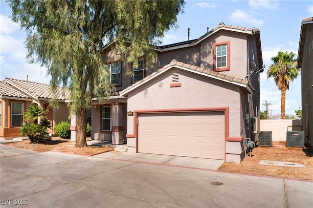 2400 Dutchmans Pipe Ct, Las Vegas, NV 89106 - view of front facade with a tile roof, driveway, stucco siding, and a garage