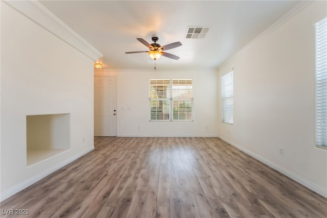 2400 Dutchmans Pipe Ct, Las Vegas, NV 89106 - unfurnished living room with crown molding, wood finished floors, and a ceiling fan