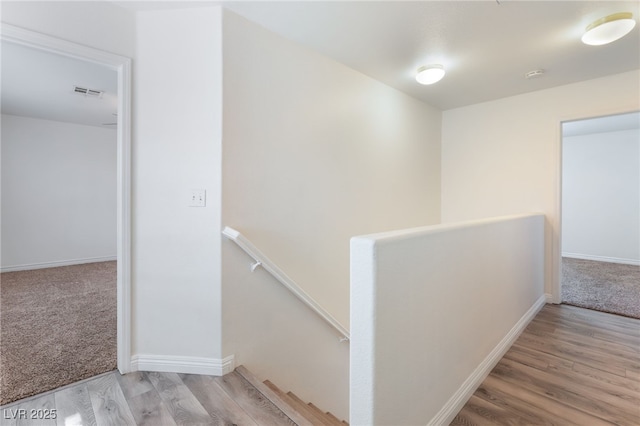 2400 Dutchmans Pipe Ct, Las Vegas, NV 89106 - hallway with an upstairs landing, wood finished floors, and carpet floors