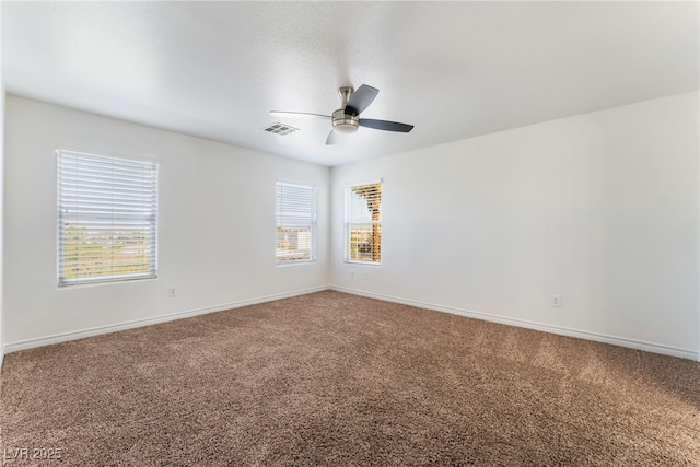 2400 Dutchmans Pipe Ct, Las Vegas, NV 89106 - carpeted empty room featuring a ceiling fan and plenty of natural light