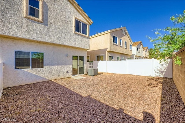8842 Duncan Barrel Ave Unit 103, Las Vegas, NV 89178 - rear view of house featuring stucco siding and a fenced backyard