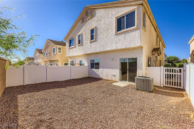 8842 Duncan Barrel Ave Unit 103, Las Vegas, NV 89178 - rear view of house with a fenced backyard and stucco siding