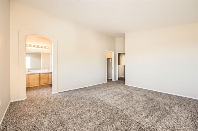 8842 Duncan Barrel Ave Unit 103, Las Vegas, NV 89178 - unfurnished bedroom with carpet, a walk in closet, and connected bathroom