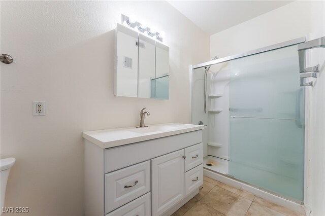 2141 Hussium Hills St Unit 108, Las Vegas, NV 89108 - full bathroom with vanity, a shower stall, and tile patterned flooring