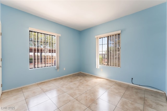 2141 Hussium Hills St Unit 108, Las Vegas, NV 89108 - unfurnished room with plenty of natural light and tile patterned floors