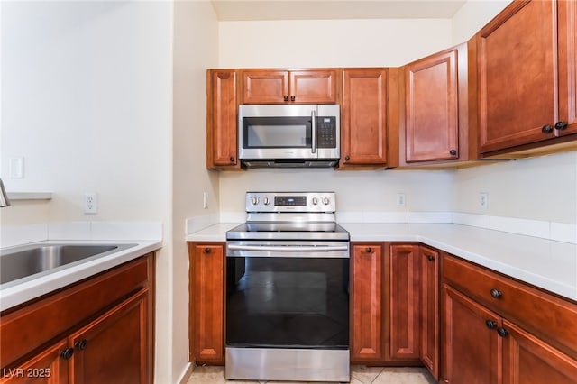 2141 Hussium Hills St Unit 108, Las Vegas, NV 89108 - kitchen featuring stainless steel appliances and light countertops