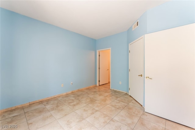 2141 Hussium Hills St Unit 108, Las Vegas, NV 89108 - unfurnished bedroom featuring light tile patterned flooring
