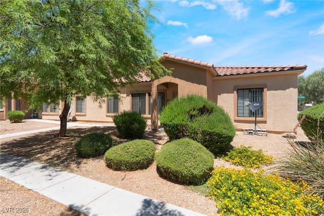 2141 Hussium Hills St Unit 108, Las Vegas, NV 89108 - view of front facade with stucco siding and a tiled roof