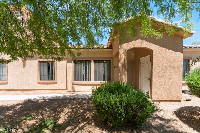 2141 Hussium Hills St Unit 108, Las Vegas, NV 89108 - view of front facade with stucco siding and a tile roof