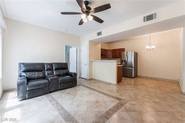 2141 Hussium Hills St Unit 108, Las Vegas, NV 89108 - living area with ceiling fan, a chandelier, and light tile patterned floors