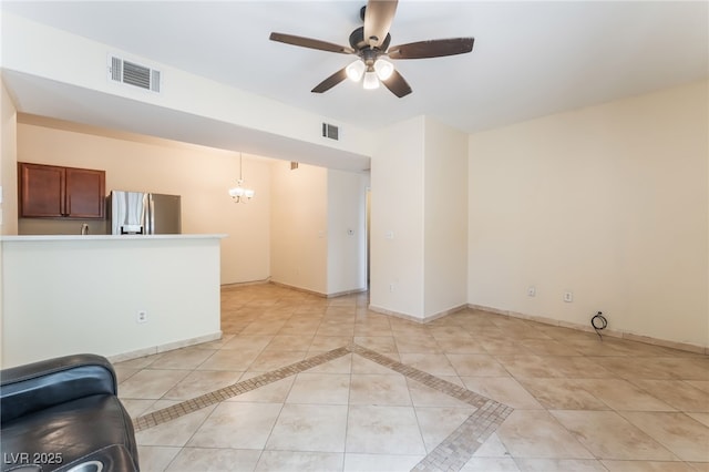 2141 Hussium Hills St Unit 108, Las Vegas, NV 89108 - unfurnished living room with a ceiling fan, light tile patterned floors, and a chandelier