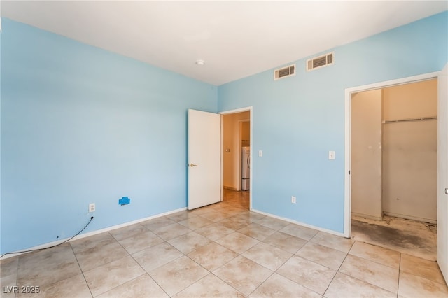 2141 Hussium Hills St Unit 108, Las Vegas, NV 89108 - unfurnished bedroom with washer / dryer and light tile patterned flooring