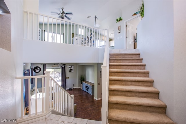 1844 Ghost Trace Ave, Las Vegas, NV 89183 - stairway with a ceiling fan, a high ceiling, and tile patterned flooring
