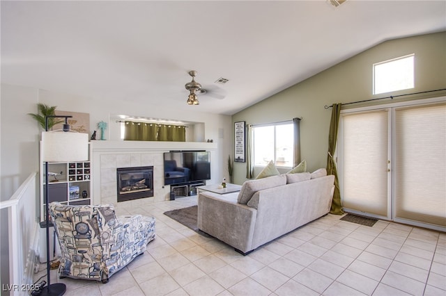 1844 Ghost Trace Ave, Las Vegas, NV 89183 - living area featuring lofted ceiling, light tile patterned flooring, a ceiling fan, and a fireplace