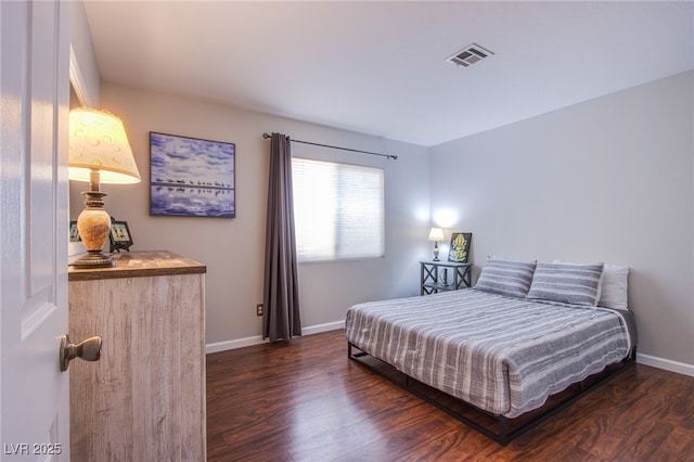 1844 Ghost Trace Ave, Las Vegas, NV 89183 - bedroom featuring dark wood-type flooring and baseboards