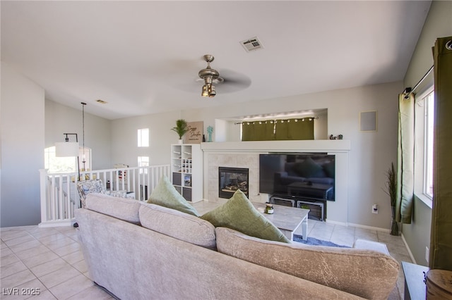 1844 Ghost Trace Ave, Las Vegas, NV 89183 - living room featuring light tile patterned floors, ceiling fan, and a fireplace