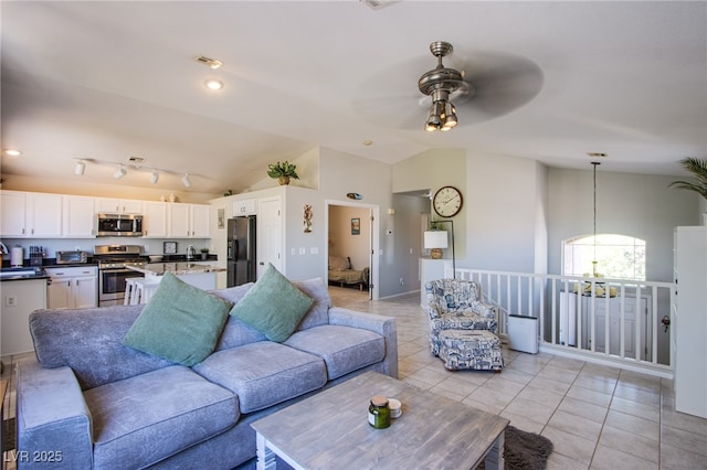 1844 Ghost Trace Ave, Las Vegas, NV 89183 - living area featuring a ceiling fan, light tile patterned flooring, lofted ceiling, and a chandelier