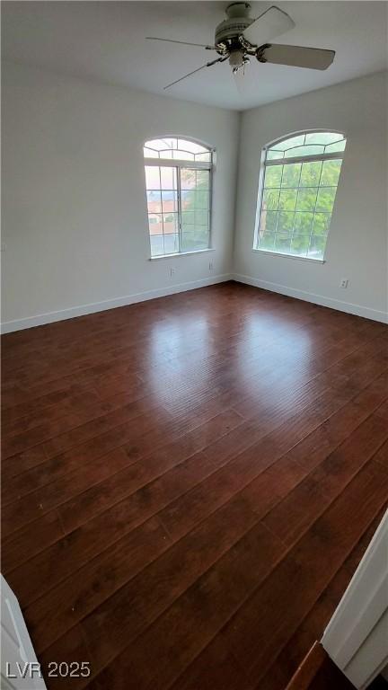 3930 Starfield Ln, Las Vegas, NV 89147 - unfurnished room featuring dark wood-type flooring and ceiling fan