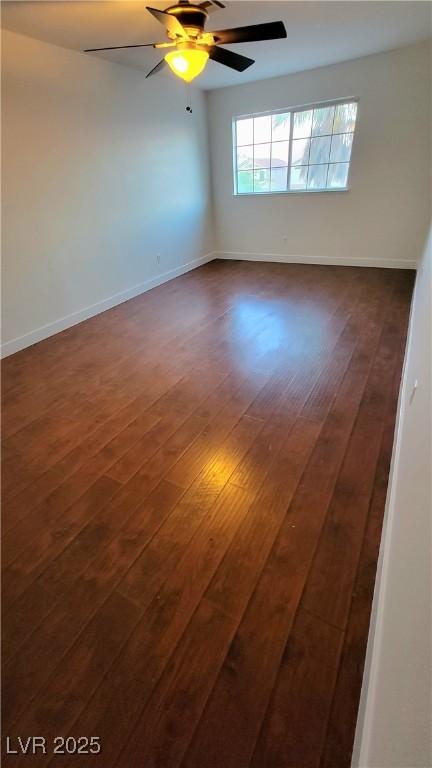 3930 Starfield Ln, Las Vegas, NV 89147 - empty room featuring dark wood-style floors and a ceiling fan
