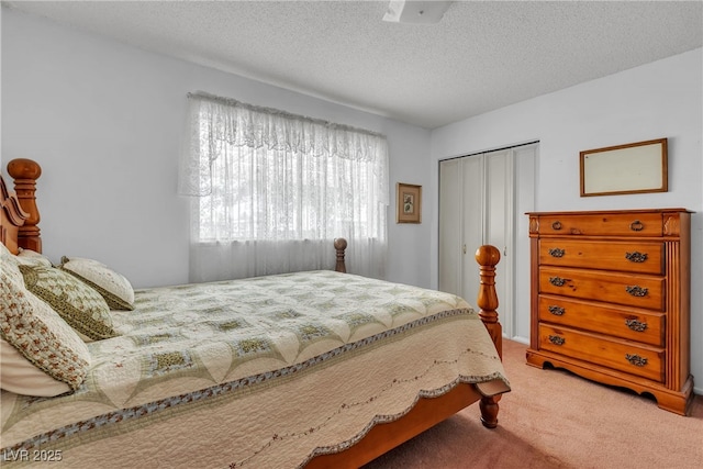909 Biljac St, Las Vegas, NV 89145 - bedroom featuring light colored carpet, a closet, and a textured ceiling