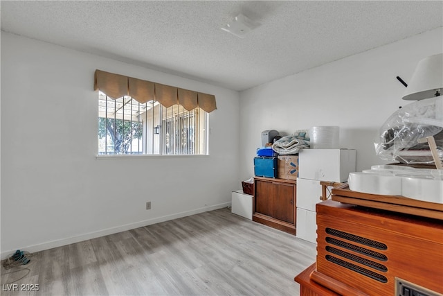 909 Biljac St, Las Vegas, NV 89145 - home office with a textured ceiling and light wood finished floors