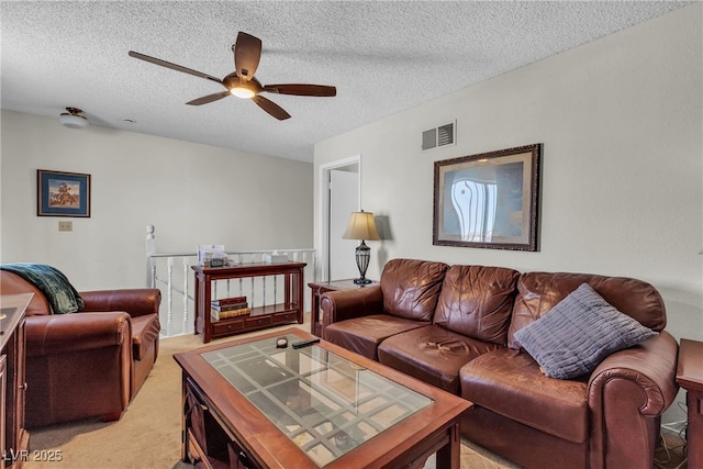 909 Biljac St, Las Vegas, NV 89145 - living area with light carpet, a textured ceiling, and ceiling fan