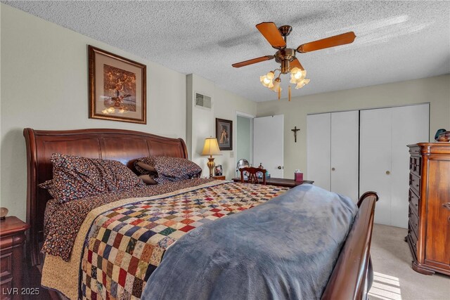 909 Biljac St, Las Vegas, NV 89145 - bedroom featuring light colored carpet, a closet, a textured ceiling, and ceiling fan