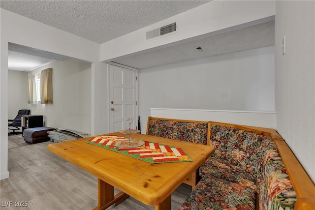 909 Biljac St, Las Vegas, NV 89145 - dining room with light wood finished floors and a textured ceiling