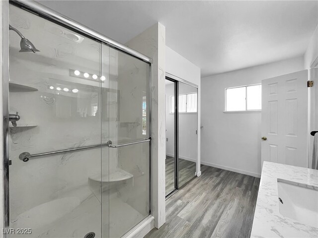 909 Biljac St, Las Vegas, NV 89145 - bathroom with a shower stall, wood finished floors, and vanity