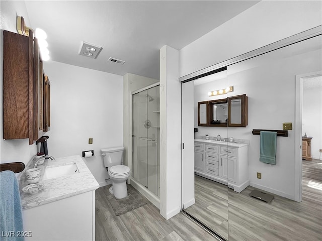 909 Biljac St, Las Vegas, NV 89145 - full bathroom featuring wood finished floors, vanity, and a stall shower