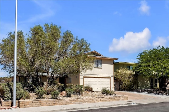 909 Biljac St, Las Vegas, NV 89145 - view of front of home featuring an attached garage and concrete driveway