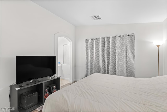8843 Tomnitz Ave Unit 102, Las Vegas, NV 89178 - bedroom with arched walkways and baseboards